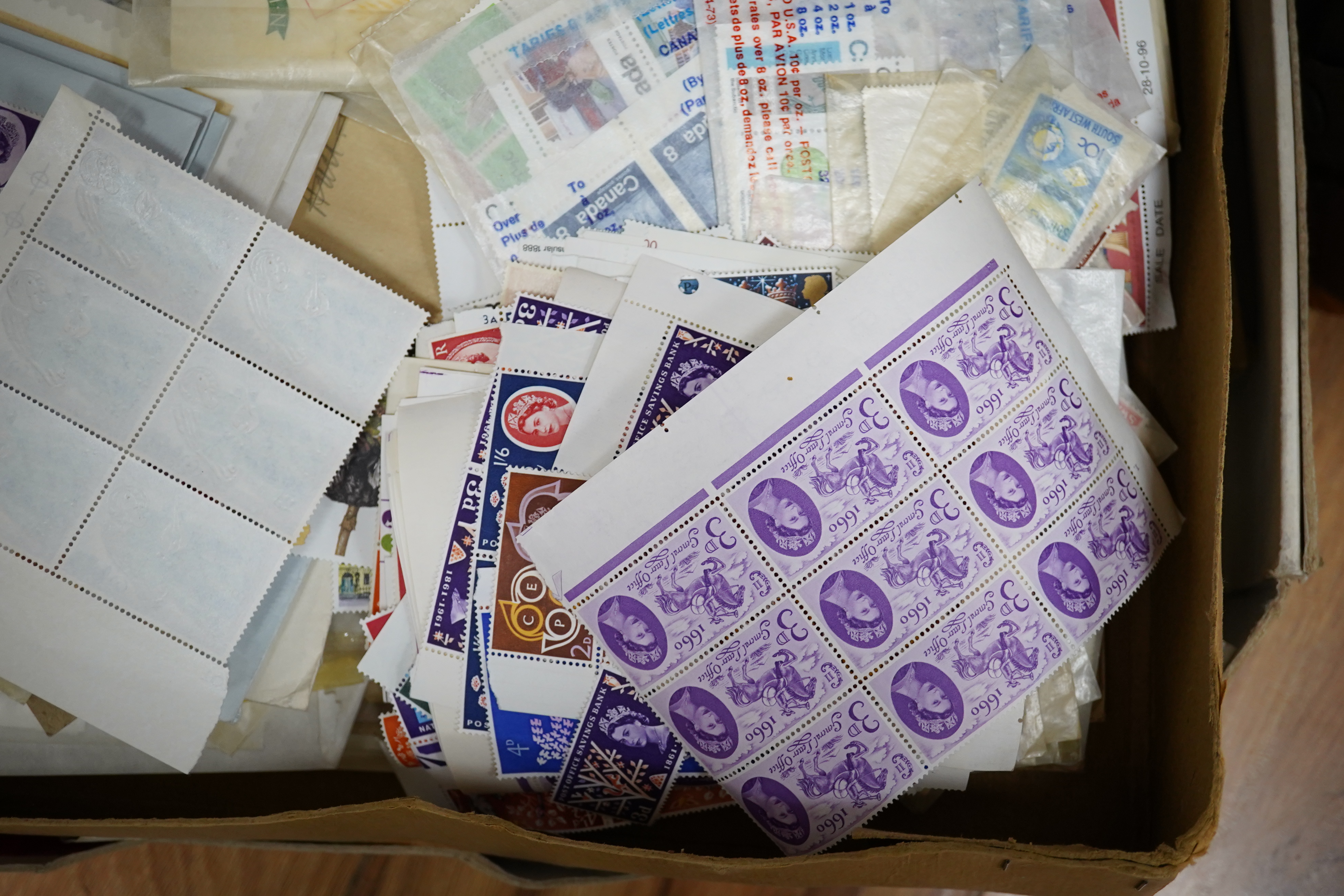 A large quantity of mint stamps, booklets, autograph albums, a sketch book, photos, etc. (2 boxes). Condition - mixed, poor to good